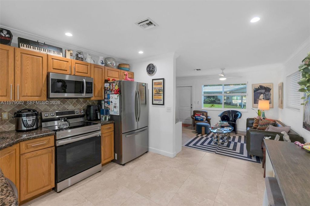 Photo of 2805 NW 52nd Ct, Tamarac, FL 33309 (MLS # A11979002)