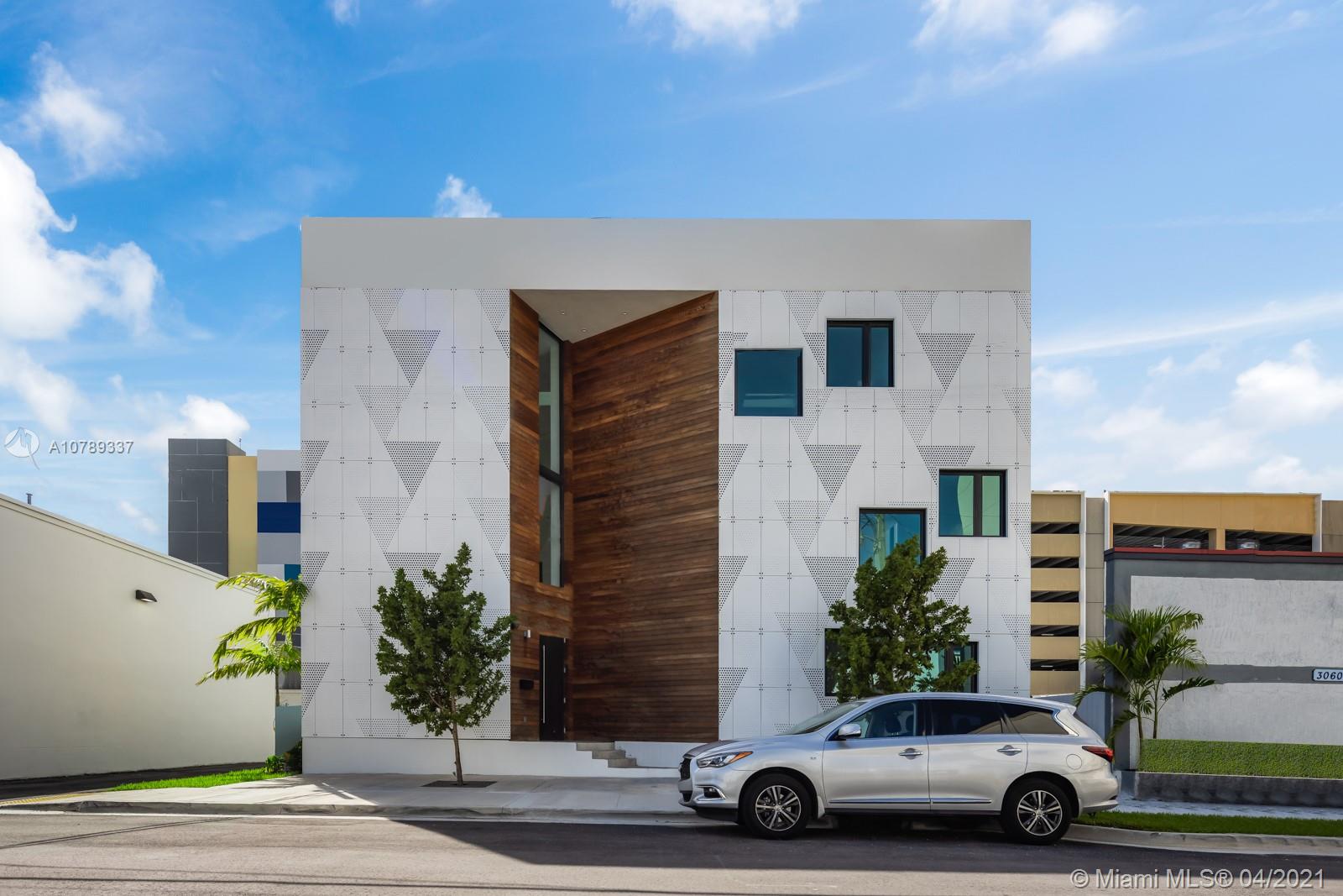 The Ultimate Man Cave/Car Garage. Rare opportunity to own a free standing building in the heart of Coral Gables to house all your toys, operate your business, or just hang out with friends. This unique property can store around 50 cars (or whatever else you want) in the massive warehouse space. This building currently has an office space, lounge area, and amazing rooftop outdoor deck and patio. There is nothing else like it on the market! Come take a tour today!