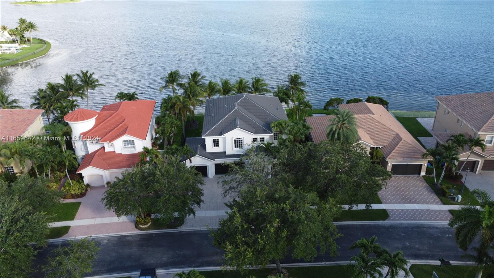 Have an amazing vacation feeling in this spectacular house located in Sunset Lakes community
with a breathtaking lake view.
The huge master suite has two walk-in closets, and it also has an impressive view of the lake. It
also has a sitting area and a balcony overlooking the pool and the lake, perfect for having
breakfast while enjoying the view of the sun rising on the lake in the morning. The bathroom in
the master suite has “his” and “her” private toilets baths.
French impact doors and accordion shutters.
The roof was completed replaced in 2023 and the house exterior painted in 2024.
Large remote-controlled electric powered Italian awning in pool area equipped with wind speed
sensor for protection.3 car’s covered garage with automatic opening doors. Affordable HOA fee
