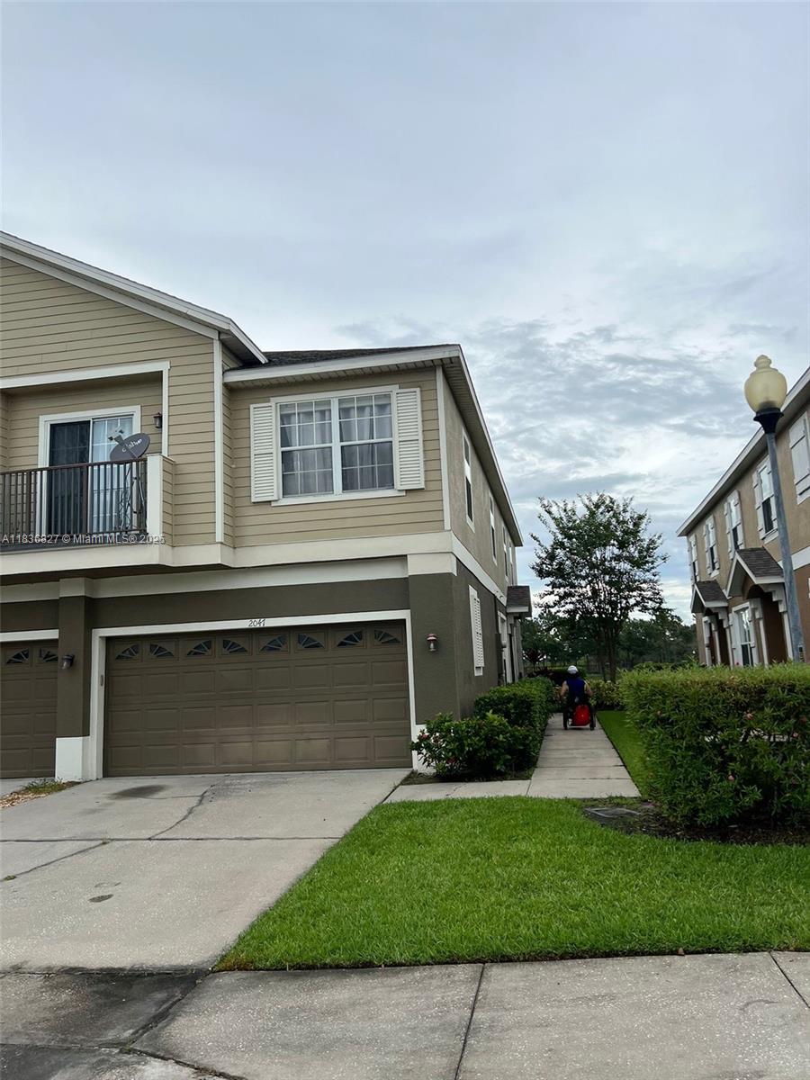 This NEWLY PAINTED 3-bedroom, 2-bathroom townhome features an open split floor plan with double sinks in the master bathroom and a large master walk-in closet. The spacious, clean kitchen boasts ample cabinet space and stainless-steel appliances. The large laundry area includes a washer and dryer. An attached 2-car garage and a two-car driveway provide ample space. The property is just a 20-minute drive from all major theme parks. Historic Downtown Kissimmee is just a 5-minute drive away, offering a variety of shopping, dining, and entertainment venues, including Kissimmee Lakefront Park.