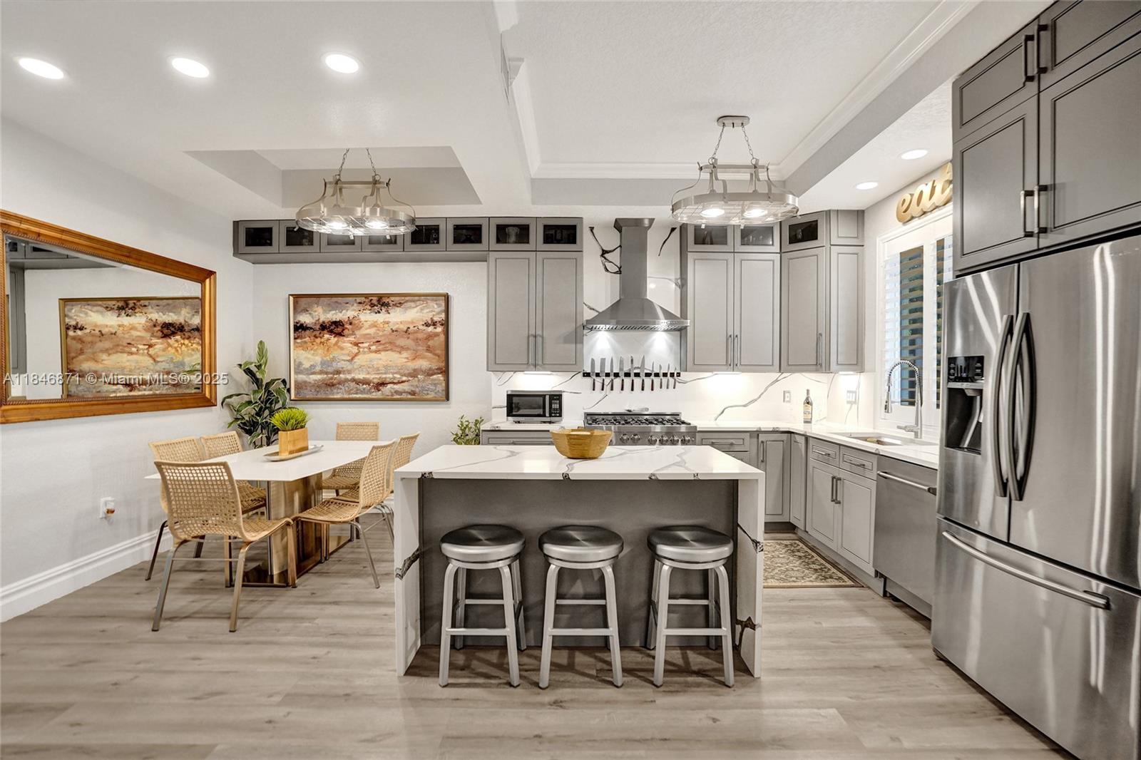 Live in the charming, historic Parrot Cove neighborhood of Lake Worth Beach—walking distance from THE BEACH, downtown dining, shops, and the golf course. This solid concrete home with over $70k of upgrades features luxury 10” vinyl floors, 10’ ceilings, and hurricane impact windows and doors. Enjoy a chef’s kitchen with Quartz counters, custom greige cabinets, stainless steel appliances, and a 36” natural gas stove. Other highlights include a newer HVAC (2022), tankless water heater, alarm system, plantation shutters, and built-in closets. Bathrooms are finished with marble and granite, frameless showers, and high-end touches. Pets allowed. Community include grills, pool, parking, pest control, roof maintenance. **This property qualifies for the RENT TO OWN HOMEOWNERSHIP PROGRAM**