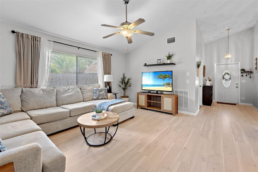 Welcome to this beautifully maintained 3-bedroom, 2-bathroom home in the desirable Boca Winds community of West Boca Raton. This move-in ready home features a spacious one-story layout, updated wood flooring, and major improvements including a newer roof and HVAC system (just 4 years old). Enjoy outdoor living with a large, fully fenced backyard and an oversized covered patio—perfect for entertaining, relaxing, or creating your own private oasis. Conveniently located near A-rated schools, parks, shopping, and dining, this home is ideal for families, first-time buyers, or anyone looking for comfort and value in a prime location.