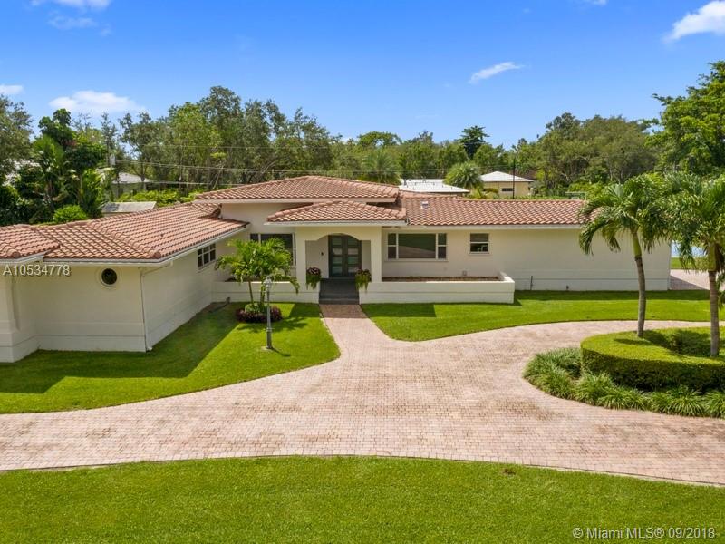 Beautiful & completely remodeled builders acre Pinecrest home! 2018 renovations include Italian Ceramiche porcelain flooring thru-out, brand new state-of-the art chef's kitchen, all new appliances w/ 6 burner gas Thermador range, Fortis pasta water filler, Zephr vent hood & cambria quartz counters. New laundry rm, whirlpool washer/dryer, 2 new A/C's w/Ecobee controllers, 2 new water heaters. All new Hunter Douglas window treatment throughout & ceiling fans. New LED lighting and doors thru-out, Pool-Salt system w/ remote Hayword/aqua link controller. Impact windows and newly installed impact front door and garage w/new motor. Versacourt multi-use basketball, volleyball w/new LED lighting. 8 exterior security cameras. Generator 18 KW, Termite tenting 2017, Barrel tile roof 2013. Flood zone X