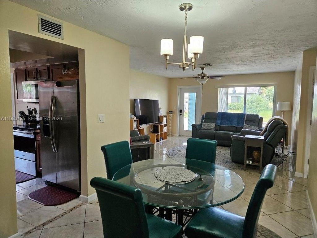 Photo of 4613 NW 30th Ter, Tamarac, FL 33309 (MLS # A11980435)