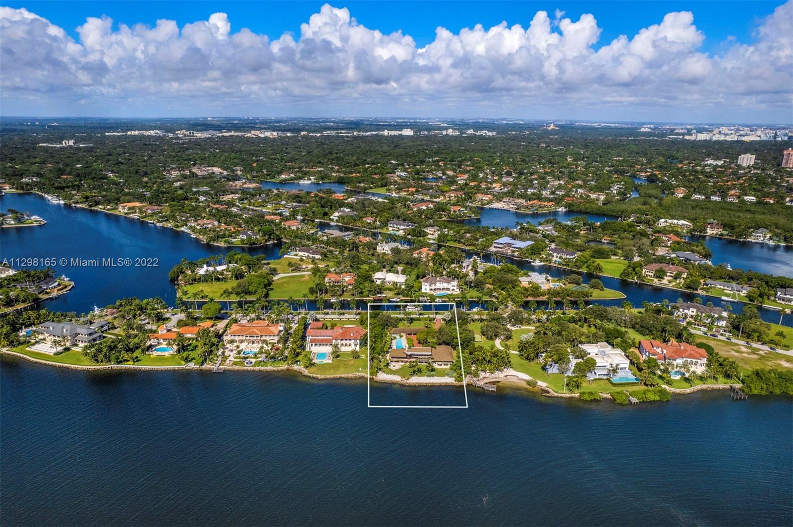 A once in a generation opportunity to own one of South Florida’s premiere properties inside the gated and exclusive community of Gables Estates. This almost 2 acre property, with 200 feet of direct water frontage on Biscayne Bay, allows one to enjoy expansive and unobstructed views out to Key Biscayne, Stiltsville and the ocean. An additional 200 feet of seawall, on a private and protected waterway, is located in the back of the property to dock your yacht. Build your dream home or renovate the existing property. The possibilities… like the views…are endless. This is truly a one of a kind property that is rarely ever on the market.
