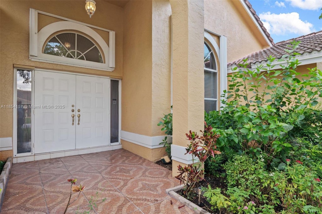 Photo of 4635 NW 99th Ln, Coral Springs, FL 33076 (MLS # A11854157)