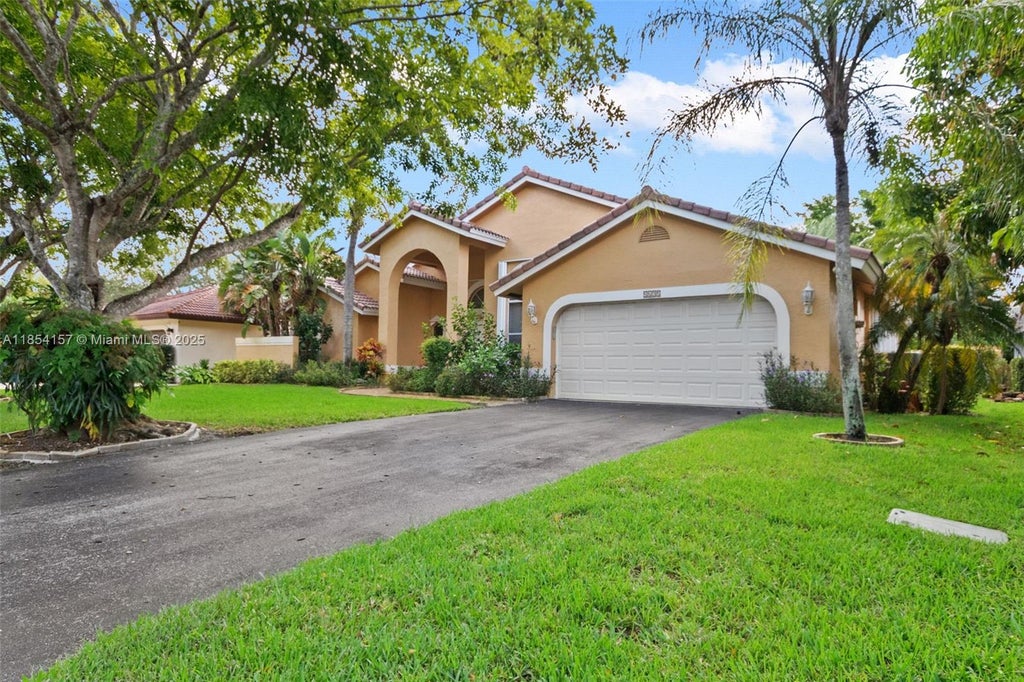 Photo of 4635 NW 99th Ln, Coral Springs, FL 33076 (MLS # A11854157)