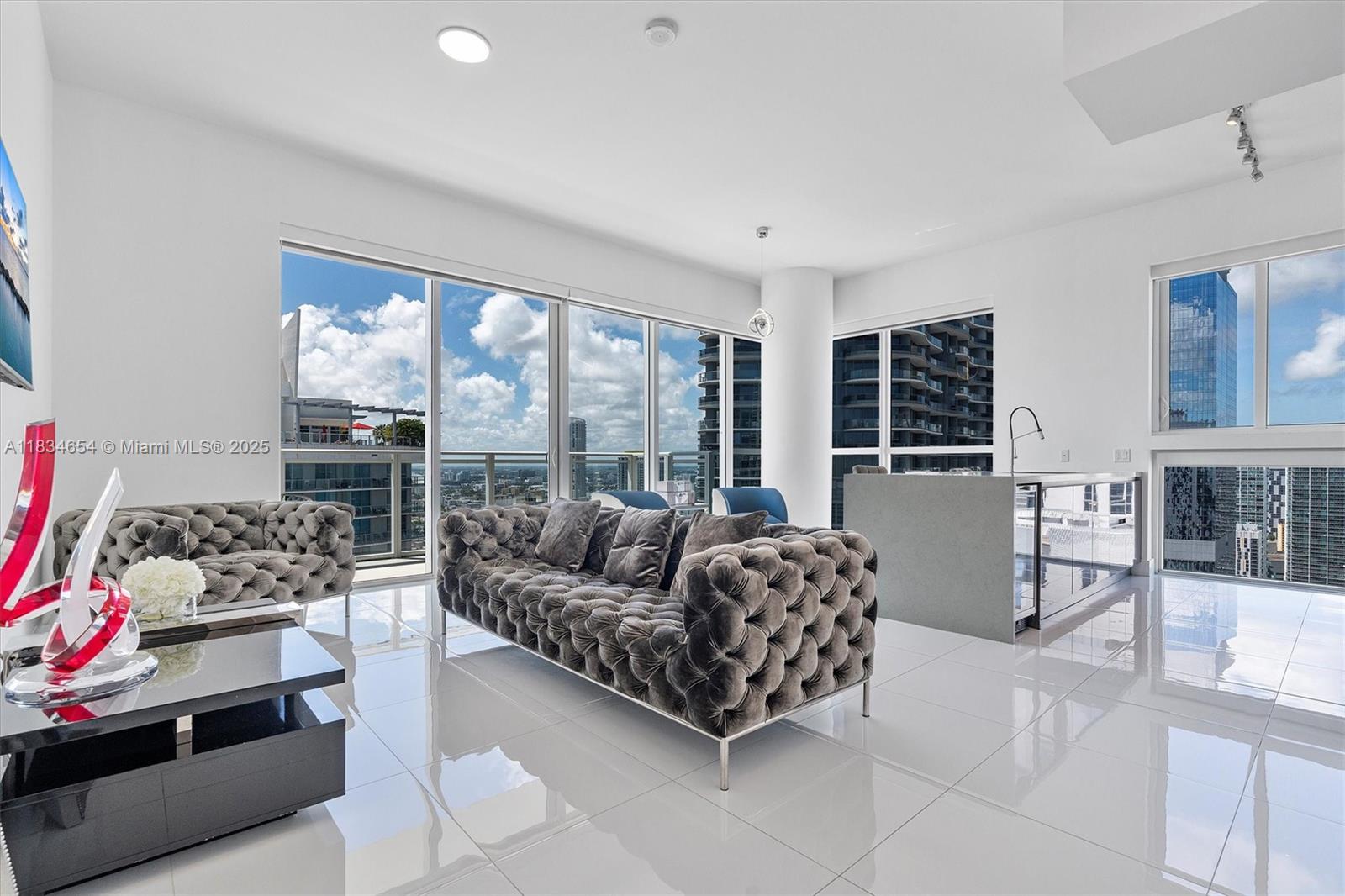 The Bond 4209 – Elegance at the Top of Brickell
Spectacular 2-bedroom, 2-bath residence on the highest available floor of the exclusive The Bond building, located in the heart of Brickell’s financial district. This northwest corner unit offers stunning views through floor-to-ceiling windows, high ceilings, and a spacious terrace.
Featuring high-end finishes, top-of-the-line appliances, installed blinds, and in impeccable move-in ready condition. Owner-occupied — fast closing available.
Luxury building with 5-star amenities, including a pool, gym, spa, kids' playroom, BBQ area, sauna, steam bath, and more. Stable and secure association, has a reserve and no special assessment. Enjoy the urban lifestyle with comfort and sophistication.