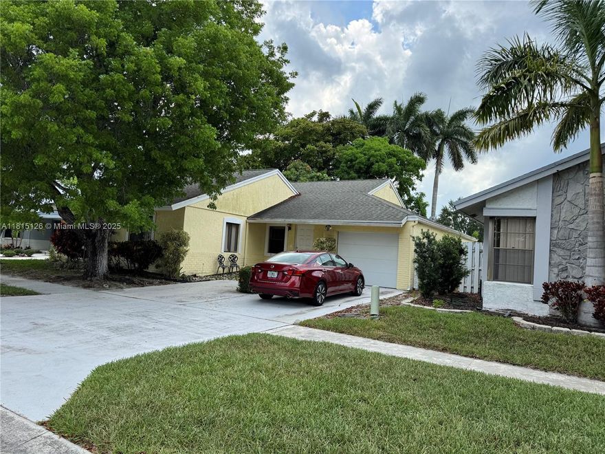 Investor special in prime West Boca Raton! This 3BR/2BA home offers a bright, airy layout with separate living, dining & casual areas, plus an enclosed patio. This property is in good condition but is  ready for updates—perfect for first-time buyers willing to renovate or investors seeking rental income. Located in a private community with tennis, pickleball, and near 3 top parks, schools, shops, dining & diverse places of worship. Priced below market for quick sale. Roof replaced 2006 | AC 2019 | WH 2025 Sold as-is; seller may require short leaseback.
