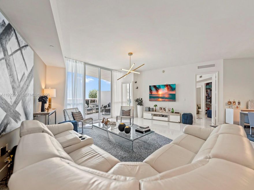 Luxury two-bedroom, two-bathroom oceanfront lanai condominium offering 1850 square feet of living space and features an oversized private terrace with direct access to the pool deck. Resembling a beach house, it boasts a generously high ceiling living room with views through 10-foot-to-ceiling windows. The spacious master bedroom with an en-suite bathroom, a modern kitchen, Exclusive beachfront amenities include private beach chairs, an oceanfront gourmet restaurant with on-demand delivery to your beach chair, an opulent clubhouse, a state-of-the-art fitness center, his and her health spas, two lap pools with attendants, valet service for two cars accessible via an on-call app, and a business center. Additionally, the property features a newly and spectacular renovated patio and pool area.