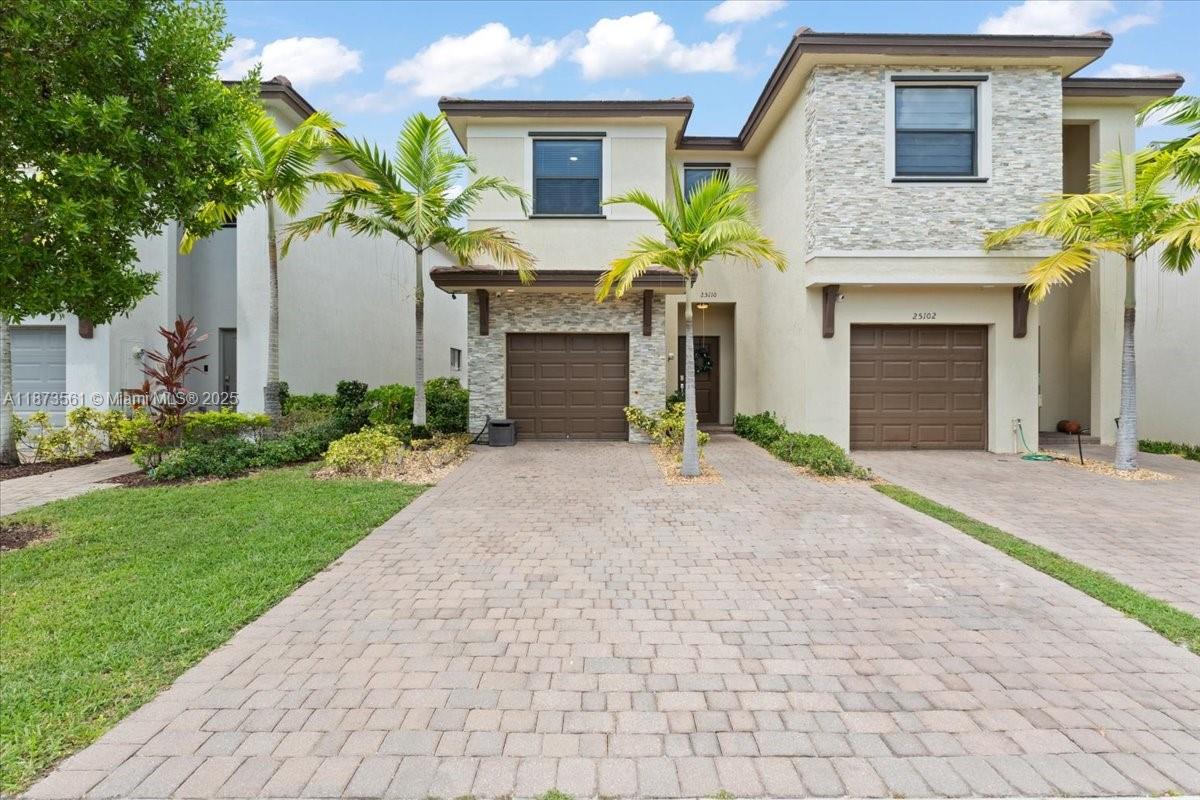 Welcome to this beautifully maintained 3-bedroom, 2.5-bath twin home in the sought-after Campo Bello community in Homestead. This move-in-ready home features quartz countertops, stainless steel appliances, a remodeled powder room, tile flooring on the first floor, and carpet upstairs. Crown moldings and a warm color palette add charm throughout. The garage is converted into a versatile flex space perfect as a playroom, office, or gym.
The private backyard includes a spacious tiki hut ideal for entertaining or relaxing. Though attached, the layout and privacy feel like a single-family home. Community amenities include a pool, fitness center, clubhouse, and playgrounds. Conveniently located near top-rated schools, shopping, dining, and major highways.