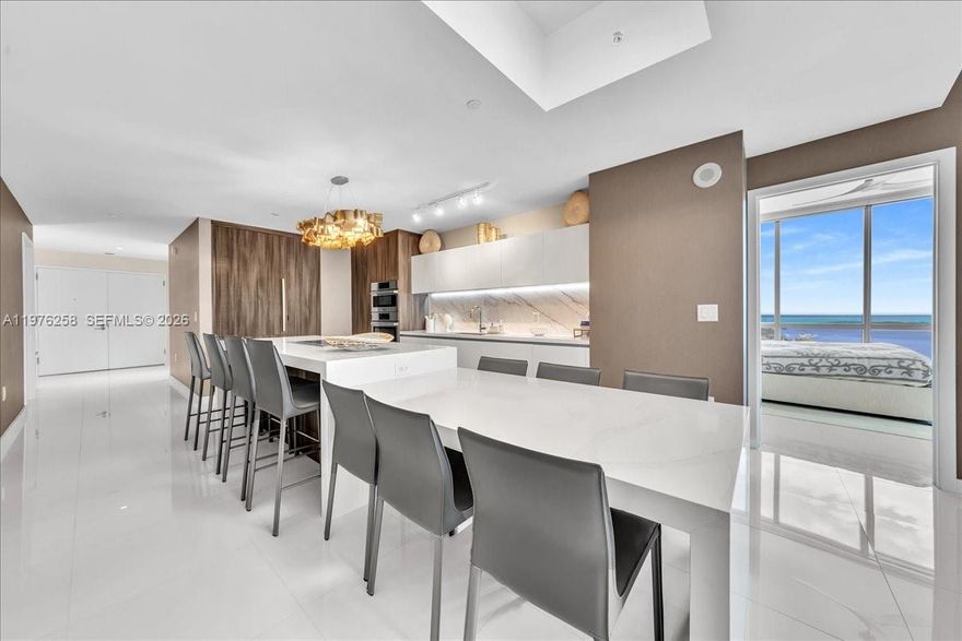 Perfect Condition Rarely Lived In – Stunning corner residence with breathtaking direct ocean views at Paramount Miami Worldcenter. This pristine home features 3 bedrooms + a large den easily convertible to a 4th bedroom, 4 full bathrooms, a private elevator foyer, 10-ft ceilings, expansive living area, custom walk-in closets, laundry room, and a private in-law suite with separate entrance—perfect for guests or multigenerational living. Rare Plus: two extra-wide side-by-side parking spaces. Paramount offers one of Miami’s most impressive amenity collections including 4 resort-style pools, massive fitness center, basketball court, tennis courts, racquetball court, soccer field, golf simulator, recording studio, business center, game room, children’s playroom and more. Located in the heart of Miami Worldcenter steps from dining, shopping, and entertainment.