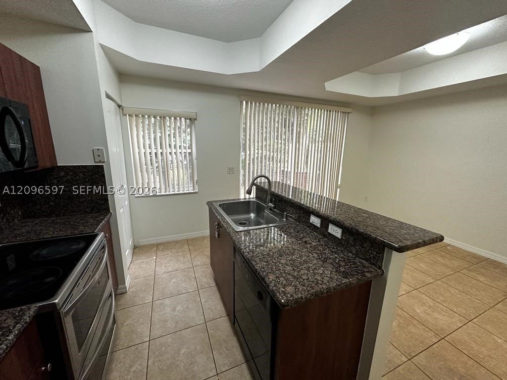 Photo of 3070 S Red Mangrove Ln S #202-2, Dania Beach, FL 33312 (MLS # A12096597)