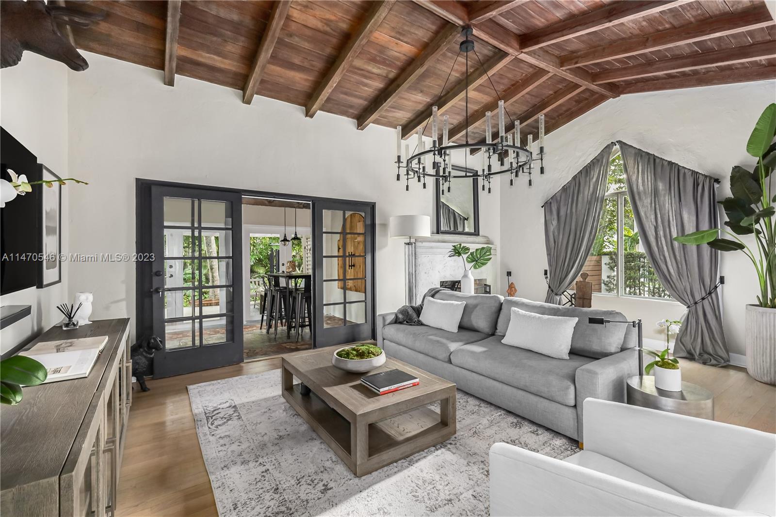 Miami meets Bali in this gracious 1935 Mediterranean Revival home nestled in Beautiful Belle Meade. The oversized 12,500' corner lot is gated and fenced for total privacy, the largest of its kind in the area. The outdoors feature Miccosukee Tribe Chickee-Hut's, a lush tropical/botanical garden of exotic plants, a 3,500-gallon Koi Pond with a waterfall. Multiple areas surround the property for the ultimate entertainment home. Commercials, movies and many model shoots have taken place over the years. This elegant home have been lovingly preserved, enhanced by modern updates to the highest standards. Interior features 12' open-wood beam vaulted ceiling and original details throughout. New updated true Chef's kitchen with Sub-Zero and WOLF. Self contained Pool Cabana with separate entrance.