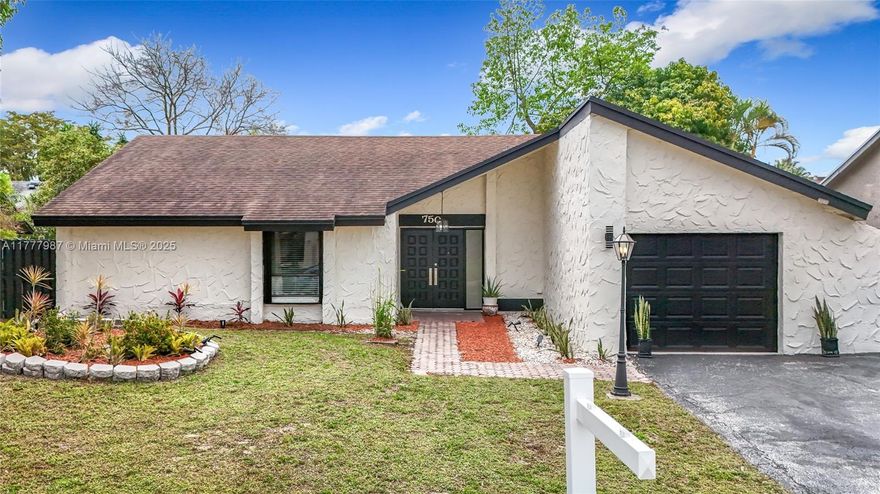 Stunning 3-bed, 2-bath home with 1,533 sq ft of living space and total 1,739 sq ft on a quiet cul-de-sac in the heart of Plantation Hills. Features soaring wood ceilings, elegant Italian porcelain tile, and a beautifully remodeled master bath with floating double sinks and black marble accent wall. Spacious kitchen opens to a bright living and dining area with views of a large backyard perfect for a pool, garden or outdoor retreat. Located just 7 blocks from Plantation Walk's shops, dining, and wellness centers.