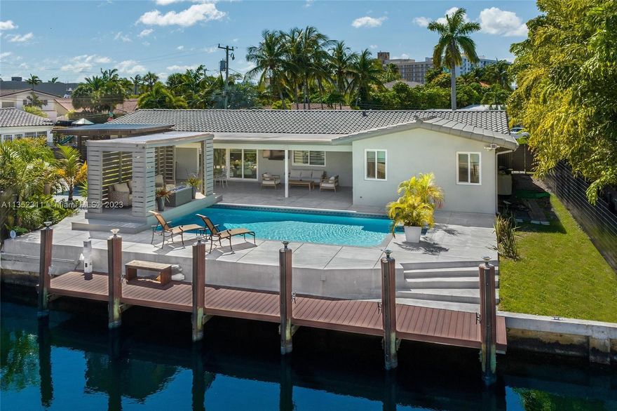 This modern waterfront masterpiece nestled in Eastern Shores is not one to miss! Take in all of the glamorous home upgrades and exquisite designer features including a chefs kitchen with top of the line appliances, Calcutta marble throughout the home, built-in bar, fireplace and more!  This high-tech property offers many of the advancements of new age technology, including 16 home cameras and surround sound. Take entertainment outside with poolside lounging area, summer kitchen equipped with bbq, wine & mini fridge, and endless water views. With 58 feet on the water and your own private dock, this home calls for all boating lovers! True South Florida style living is found here! Seller financing available.