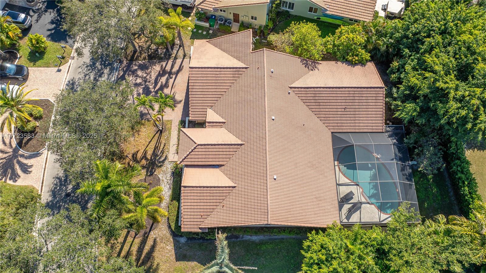 Beautiful and Spacious Home Located in the Highly Desirable Ridgeview Community of Coral Springs. This 5 Bedroom, 2.5 Bathroom Home Offers an Impressive 2,803 Sq Ft of Living Space, Providing Plenty of Room for Family Living and Entertaining. Split Bedroom Layout Ensures Privacy, Vaulted Ceilings Throughout Create an Open, Airy Feel! This Home Features a Formal Living Room & Formal Dining Room. Kitchen Offers Wood Cabinets, Pull-Outs, Extra Cabinet Space and Granite Countertops with Ample Room to Work and Entertain. Enjoy the Outdoors in the Screened Pool Area. Mango Tree in the Backyard. Oversized Driveway can Accommodate up to 6 cars!! Newer AC, Roof 2005. This Home Presents Tremendous Potential to Personalize and Update, Making it an Ideal Choice to Create your Dream Space! Must See!!
