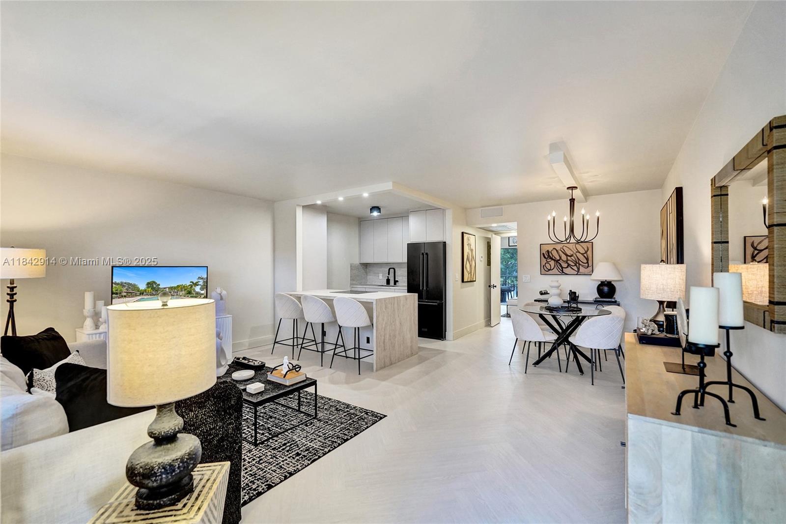 Beautifully renovated in Century Village, Pembroke Pines. This modern unit features an open kitchen with quartz counters, waterfall island, sleek black appliances, and custom cabinetry. Porcelain tile flooring throughout, updated baths, and designer finishes create a turnkey, move-in-ready space. Enjoy natural light, garden views, and a peaceful 55+ community with resort-style amenities: pools, clubhouse, gym, theater, golf, tennis, and 24-hour security. Cable, water, and internet included. Prime location near shops and highways.