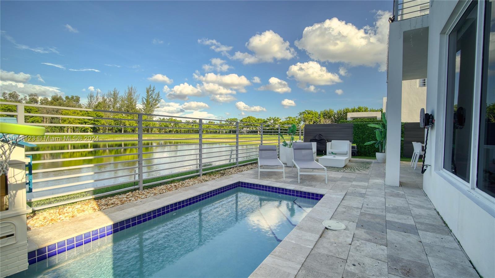 Discover unparalleled luxury in one of Doral’s most prestigious communities. This exquisite modern home boasts opulent marble floors throughout the living areas and elegant wood flooring in the bedrooms. The meticulously designed closets maximize storage space and functionality. Enjoy stunning views of the pool and lake from the kitchen, living room, and primary suite. With 24-hour security and a state-of-the-art clubhouse offering resort-style amenities, you’ll experience a lifestyle akin to a luxury vacation every day.