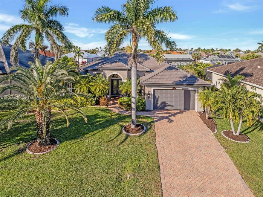 This beautifully maintained Cape Coral residence offers the ideal blend of comfort, style and Florida lifestyle appeal in a highly desirable southwest location. Thoughtfully designed with an open and inviting layout, the home features spacious living areas filled with natural light, creating a warm and welcoming atmosphere from the moment you enter. The kitchen is well-appointed and positioned to serve as the heart of the home, seamlessly connecting to dining and living spaces that are perfect for everyday living and entertaining alike. Generously sized bedrooms provide comfort and privacy, while the primary suite serves as a peaceful retreat with ample closet space and a well-designed bath. Additional peace of mind is provided by a full house Generac generator, ensuring reliable power and uninterrupted comfort year-round. Step outside to enjoy a private outdoor oasis featuring a pool and spa, along with a 10,000-lb boat dock that offers convenient access to the waterways and the ultimate Southwest Florida boating lifestyle. The property is situated in an established neighborhood known for pride of ownership, with convenient access to waterfront dining, shopping, parks, marinas and top-rated schools. Whether you are seeking a full-time residence or a smart long-term investment, this home delivers timeless appeal, functionality and the opportunity to enjoy the laid-back yet refined lifestyle Cape Coral is known for.