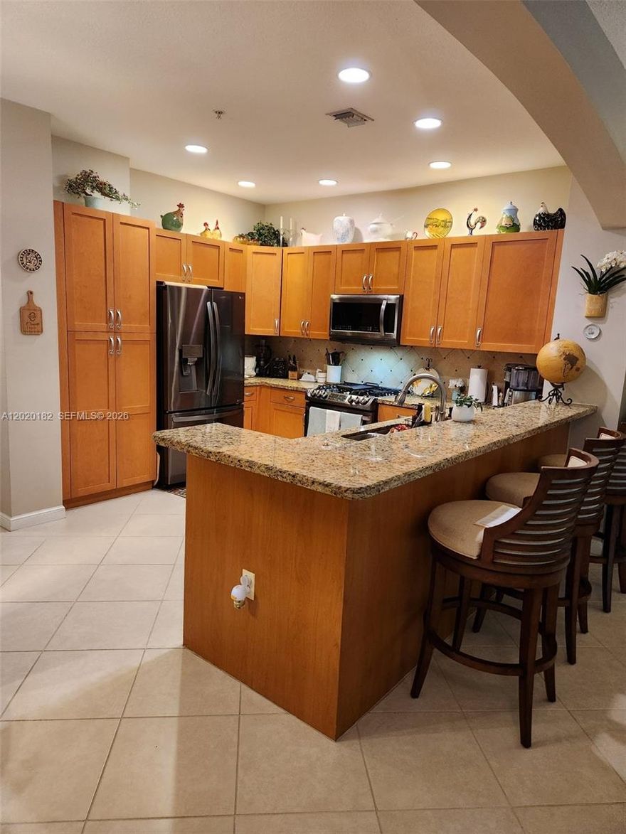 Elegant and spacious corner unit features a split 2 bedroom/2 bath design.  The open kitchen design features newer high-end LG stainless steel appliances, granite countertops and a cozy dining area.  Ceiling fans throughout and Plantation Shutters on the windows.  Tastefully decorated and well maintained.  Master bathroom features dual sinks, a roman tub and a separate  shower.  Community resort style ammenities include a fitness center, tennis & pickle ball, sauna, basketball court, fiber optic Wi-Fi & much more! Best priced unit on the market in Artesia.   All special assessments are paid in full!  This is a MUST SEE!