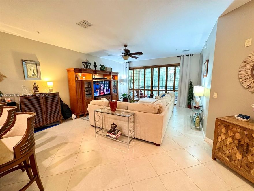 Elegant and spacious corner unit features a split 2 bedroom/2 bath design.  The open kitchen features newer high-end LG black stainless steel appliances, granite countertops and a cozy dining area.  Ceiling fans throughout and Plantation Shutters on the living room windows.  Tastefully decorated and well maintained.  Master bathroom features dual sinks, a roman tub and a separate  shower.  Community resort style amenities include a state-of-the-art fitness center, tennis & pickle ball, sauna, indoor basketball court, fiber optic Wi-Fi, 3 pools & much more! Best priced upgraded unit on the market in Artesia which has close proximity to Sawgrass Mills and Amerant Bank arena.   All special assessments are paid in full!  This is a MUST SEE!