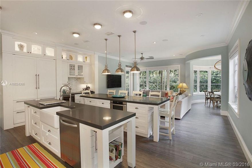 Rare opportunity! Turn-key luxury home on one of the best streets! Custom built in 2004, fully renovated in 2012, this 5 bed, 4.5 bath has a coveted 10,619 SF lot, 4,400 SF living area & 2 car enclosed garage.  Heart of the home is the open kitchen & family area, w/ top of the line finishes & appliances (Sub Zero Refrigerator, 2 Sub Zero Wine Coolers & propane Wolf Range).  Impeccably finished w/ impact windows, imported roof tiles, generator & landscaping for ultimate privacy in the huge back yard.