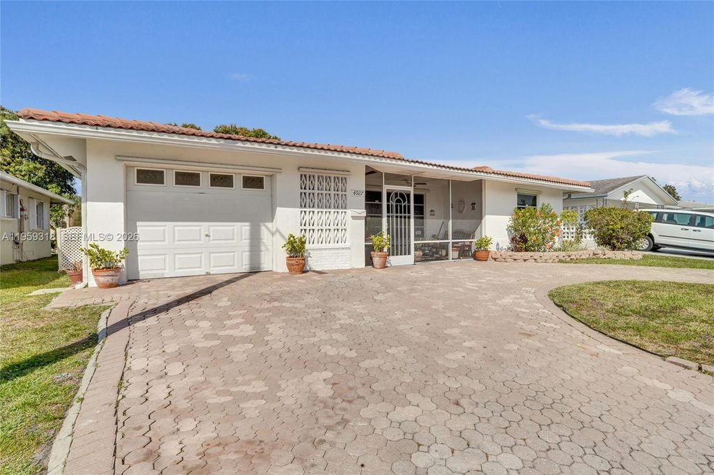 Photo of 4927 NW 55th Ct, Tamarac, FL 33319 (MLS # A11959318)