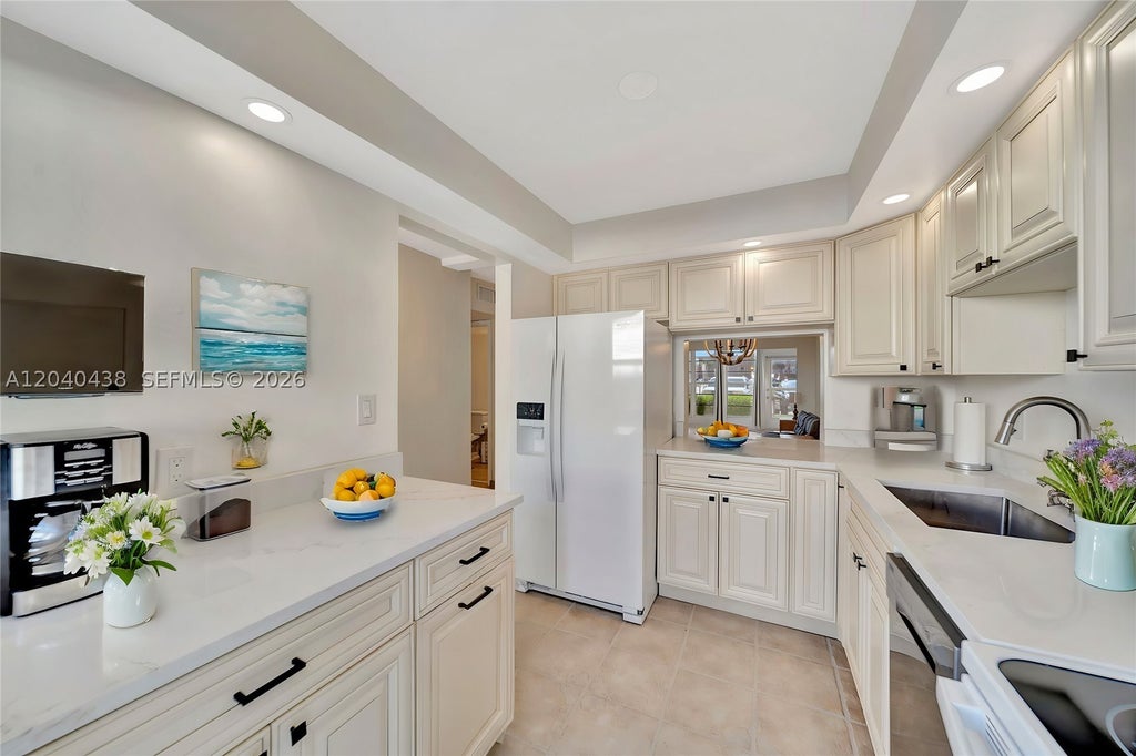 Photo of 3221 NE 8th St #103, Pompano Beach, FL 33062 (MLS # A12040438)