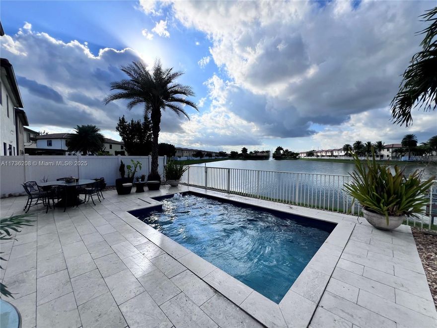 Stunning Lakefront Pool Home in Aragon! is the largest model in the community, offering luxurious living with breathtaking views. Enjoy a saltwater heated pool and elegant upgrades throughout, including 24x24 porcelain tile, laminate wood floors, crown molding, and custom window treatments. The chef’s kitchen is a true masterpiece, featuring a massive island, stainless steel appliances, a farmhouse sink, and a wine cooler. Equipped with an electric water heater and Energy Star appliances in the upstairs laundry room. Aragon’s gated community residents can take advantage of resort-style amenities, including a clubhouse, gym, playground, and pool. With its prime location,is close to schools, shopping, dining, and major highways.  Move-in ready and waiting for you—don’t miss this opportunity!