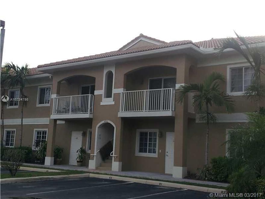 BUILT IN 2002-IMMACULATE CORNER GROUND FLOOR IN GATED COMMUNITY-PARK AT YOUR DOOR WITH 2 ASSIGNED PARKING SPOTS-BEIGE CERAMIC TILE & TEXTURED WALLS THROUGHOUT - HUGE OPEN FLOOR PLAN-1200 SQ FT LIVING AREA 31' X 13' CAN BE LIVINGRM AND FAMILYRM COMBO-LARGE MASTER BEDRM- WALK-IN CLOSETS IN BOTH BEDRMS - ALL WHITE MODERN EAT-IN KITCHEN , BREAKFAST BAR AND MORE-PRIVATE FENCED PATIO-NEW WASHER/DRYER INSIDE UNIT APPLIANCES 1 YR OLD-HURRICANE PROOF WINDOWS-COMM. POOL & EXERCISE RM-READY TO MOVE IN-