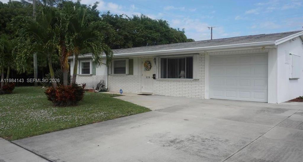 Photo of 328 Riverdale Rd, Palm Springs, FL 33461 (MLS # A11984143)