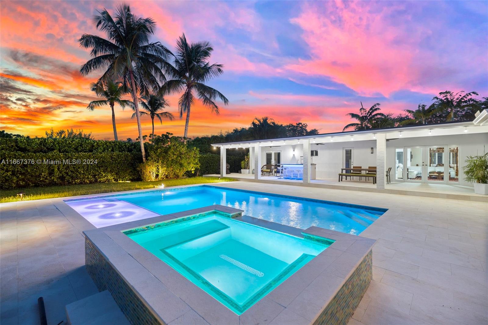 Beautifully renovated home with dedicated space for in-laws, extended family/guests or domestic staff. Move-in ready! This gorgeous 5/4, 3,573 sf home on 18,466 sf corner lot features large social spaces with a layout that maximizes sunlight, granite and S/S kitchen with island and breakfast bar, French pattern stone floors throughout, French doors all opening to brand new patio/pool/spa area with heated pool, covered terrace with built-in bar/grill, Plantation shutters, interior laundry room with sink, closet cabinetry, impact windows and doors, circular drive with side yard driveway for additional parking, fenced yard, beautifully landscaped. Minutes to Baptist Hospital, Dadeland, US1 and a short walk to Continental Park, Whole Foods, Target and other shopping venues.
