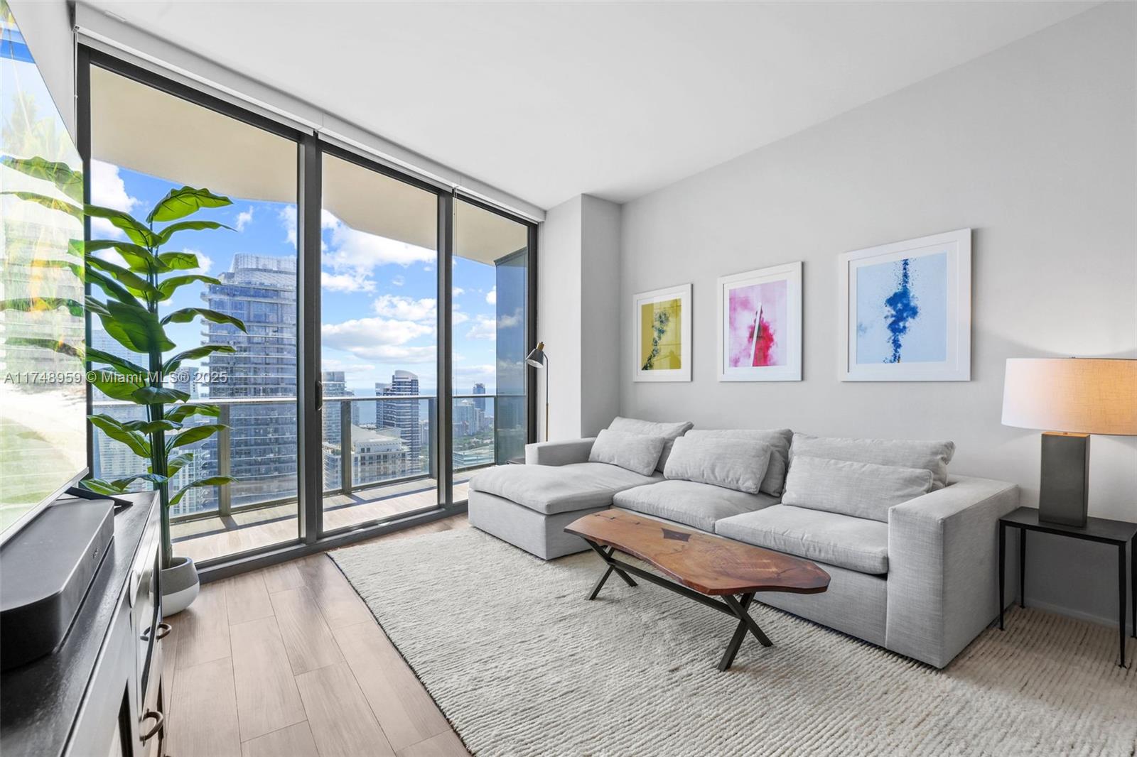 Rarely available 03 line situated on one of the highest floors the building has to offer. Indulge in the sky sweeping views of Brickell and Biscayne Bay as you get to enjoy open views of the city. Ideal option for those that work from home or need a separate den that acts as a bedroom. Two full separate bathrooms makes it ideal to host overnight guests. For those that are wanting to get a feel for the Brickell lifestyle, SLS Lux is located in the center of it all with amazing walkability and top of the line amenities. Ranging from rooftop swimming pool, tennis court/basketball court, fitness center, spa and salon, residents only club room, and more. BONUS extra ceiling height due to the high floor location. Available for 1 year lease only.