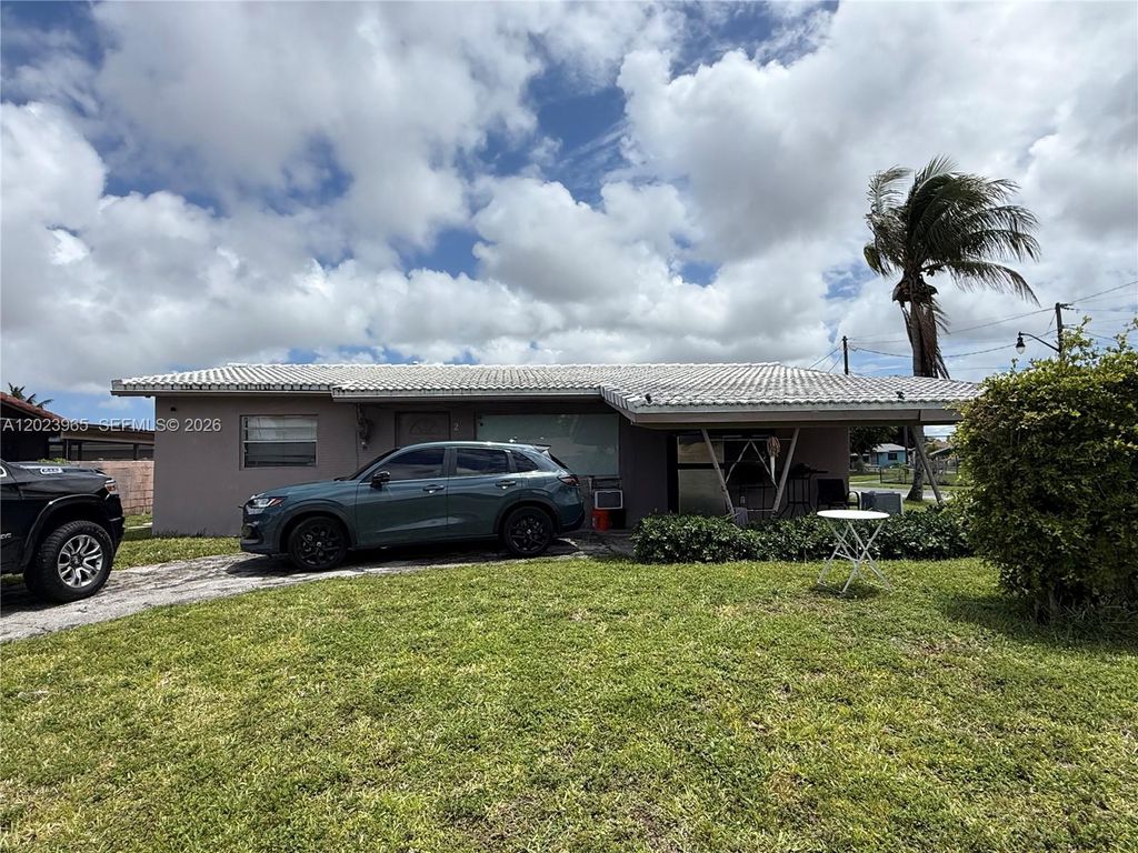 Photo of 2490 NW 12th Ct, Pompano Beach, FL 33069 (MLS # A12023965)