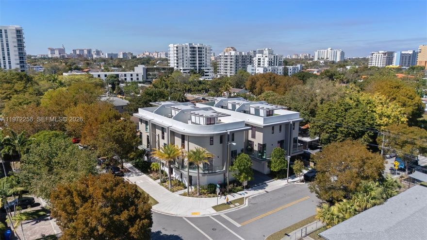 Caliza Townhomes, a boutique enclave of six new construction modern residences steps from Coconut Grove, Brickell and Downtown Miami in the highly desirable Silver Grove neighborhood. This 3 bed/3 bath townhome with over 2,300 SQ FT has 10 FT ceilinigs throughout the three interior levels. This is the best unit in the development, this rounded corner unit has more windows then the other units, which floods this home with an abundance of natural light. Upon entering this town home you feel a sense of space in the large foyer with a true 2 car side by side garage and a laundry/storage room. The open modern floorplan on your main level is perfect for entertaining. The stunning roof top terrace that has mesmorizing  downtown, brickell, South Beach and Coconut Grove views. The rooftop is the perfect setting for catching some rays or gazing at the stars. Enjoy all of the benefits of townhome living that feels like a single family home.