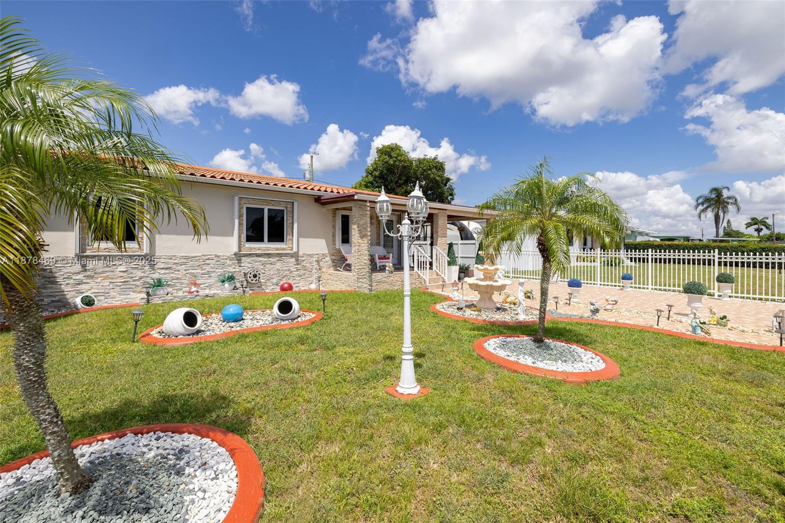 This is an IMMACULATELY maintained single family home with NO HOA with an impressive backyard area MADE for gatherings like we love to do in Miami! Excellent materials and workmanship was used to create this outdoor space that you must see to appreciate and is kept spic and span at all times. Even if you are not a fan of above-ground pools you may reconsider after seeing this one. The photos do not do justice to the property. Inside, what was previously three bedrooms is now just two better-sized rooms. There is room within the lot for future additions. The home has impact windows PLUS accordion shutters and a roof from 2020. The metal roof and offits are thoroughly cleaned and painted annually. Elevated home and not in a flood zone. Insurance friendly!