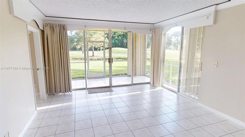 Photo of 7598 NW 86th Ter #103, Tamarac, FL 33321 (MLS # A11877193)