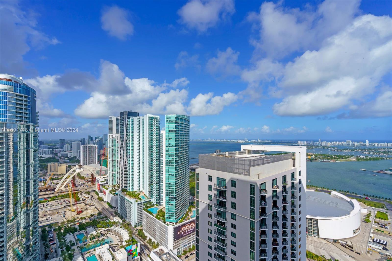 Situated in the heart of Miami World Center, brand-new, turn-key residence offering partial water and skyline views. It boasts a spacious living room with a terrace, two full bedrooms with closets, and stylish, modern bathrooms. Fully equipped kitchen with high-end appliances, including a washer/dryer and dishwasher. Perfect for couples or families looking to stay a few days, with everything in walking distance—Brickell, Bayside Park, shopping centers, cruise terminals, Brightline station, metro mover, Tri-Rail station and more. The building provides resort-style amenities such as an impressive lobby, pool, gym, and co-working spaces, and its steps away from restaurants, bars, and coffee shops. No rental restrictions—can be rented for stays as short as one day. Ideal for investors.