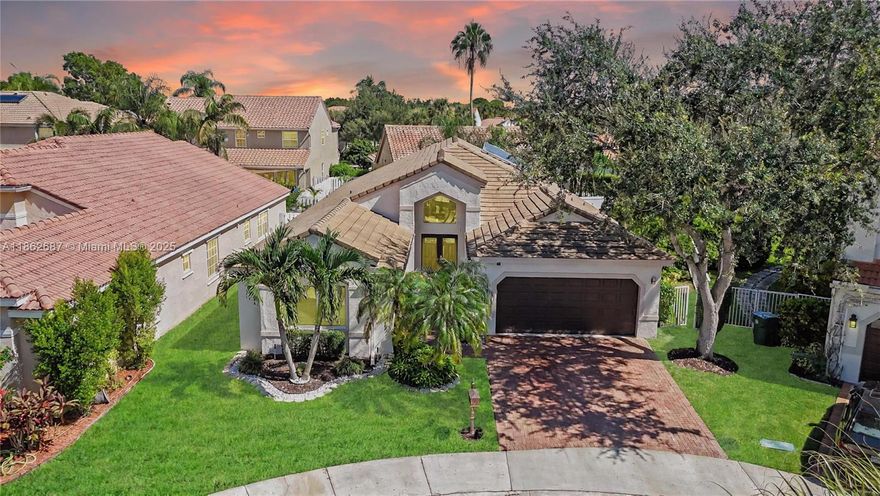 Beautifully updated one-story home, ideally located on a quiet cul-de-sac in the gated community of The Lakes in Weston. Offering 2,322 SF of living space with 4 bedrooms, 2.5 bathrooms, and a desirable split floor plan, this turnkey residence features porcelain flooring in the main areas, laminate flooring in the bedrooms, a renovated kitchen (2022), impact windows, newer roof (2020), and new AC (2023). The covered, screened patio and lush landscaping provide a tranquil outdoor setting with fruit bearing trees of Lychee, Soursop, Alfonso Mango, Barbados Cherry, and Chinese Plum. Located near A+ schools, parks, shopping, dining, and major highways, this home is priced to sell. Don't miss the chance to make this property your home. Schedule your private showing today!