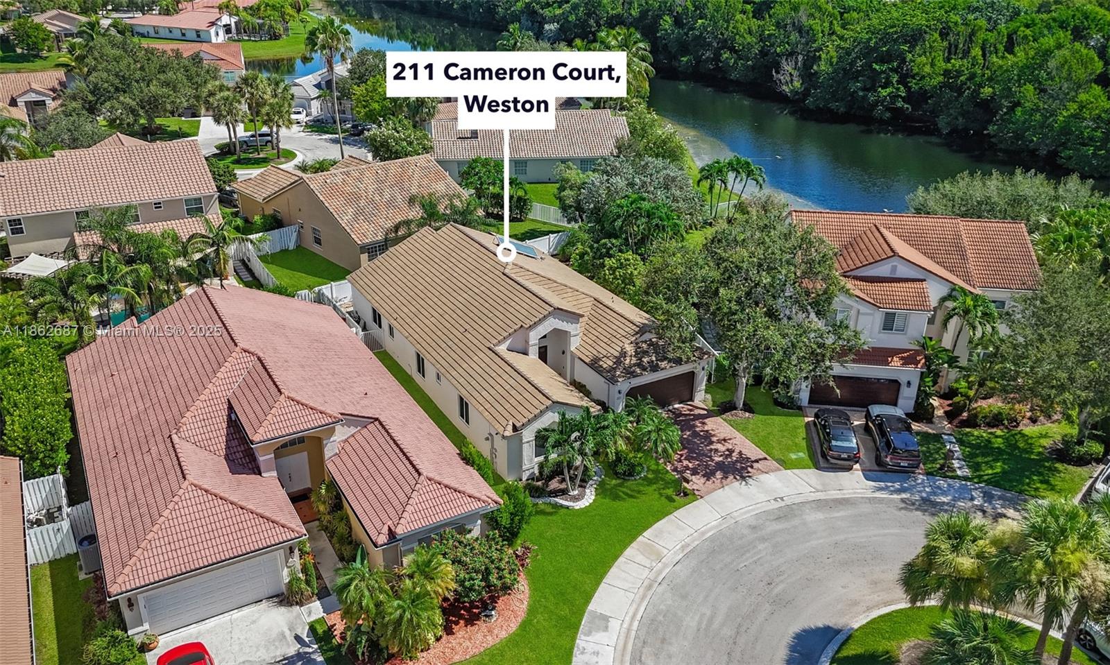 PRICED TO SELL! Beautifully updated one-story home, ideally located on a quiet cul-de-sac in the gated community of The Lakes in Weston. Offering 2,322 SF of living space with 4 bedrooms, 2.5 bathrooms, and a desirable split floor plan, this turnkey residence features porcelain flooring in the main areas, laminate flooring in the bedrooms, a renovated kitchen (2022), impact windows, newer roof (2020), and new AC (2023). The covered, screened patio and lush landscaping provide a tranquil outdoor setting. Located near A+ schools, parks, shopping, dining, and major highways, this home is priced to sell. Don't miss the chance to make this property your home. Schedule your private showing today!