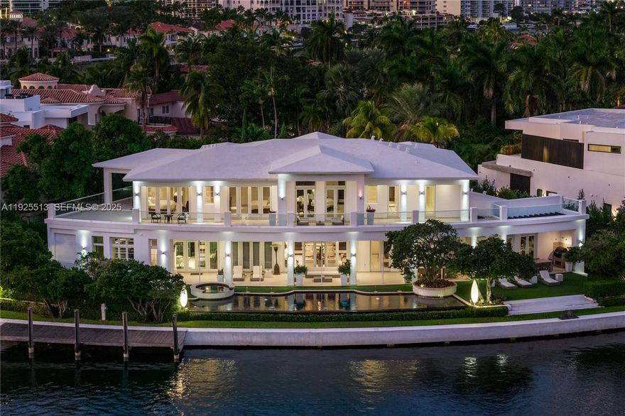 Step Inside With Me! This Golden Beach custom-built waterfront estate exudes a stately grandeur along an impressive 186' on the coveted Southern canal. A classic foyer reveals 25' ceilings and a regal staircase leading to over 7,700SF of glamorous interiors defined by a significant salon, formal dining, study, and theatre.  The primary wing boasts spacious designated wardrobes and dual baths adorned with marble. The wellness pavilion features fitness, sauna, steam, and plunge pool which extends to a 100ft saltwater pool. Outdoors, find beautifully manicured landscaping, an expansive loggia with Summer kitchen, and private dock. Premium Crestron automation, wine cellar, butler's pantry, elevator, and 2 garages in a cul-de-sac location complete this prestigious offering in a gated community.