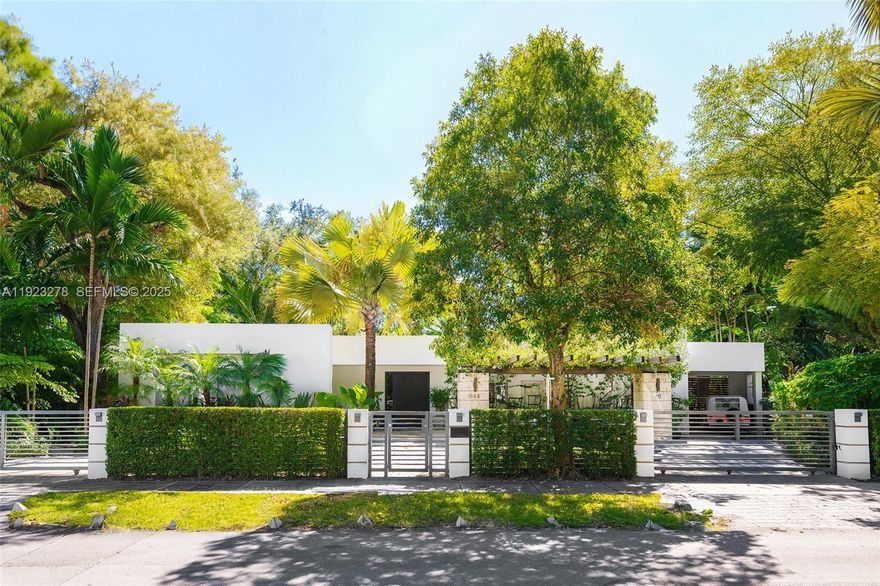 Contemporary modern home w/ stunning designer renovation in North Coconut Grove! This 5BD/5+2BA 3,379 SF residence sits on a lush 13,375 SF lot in a tree-lined neighborhood. The entryway flows seamlessly to the chic living & dining areas w/ marble flooring & floor-to-ceiling windows overlooking the serene backyard w/ resort-style pool, covered summer kitchen & cabana bath w/ outdoor shower. Custom kitchen w/ large eat-in counter, top-tier Miele appliances & custom Ital Kraft built-ins. The spacious principal suite boasts double-height vaulted ceilings, white oak floors, custom walk-in closet & spa-inspired bath w/ 2 vanities, large marble rain shower & separate soaking tub. 4 guest bedrooms w/ en-suite baths - including staff room. Incredible location near top schools, fine dining & shops.