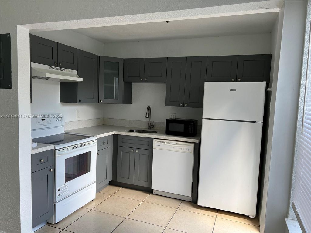 Photo of 4705 NW 9th Dr #4705, Plantation, FL 33317 (MLS # A11849541)