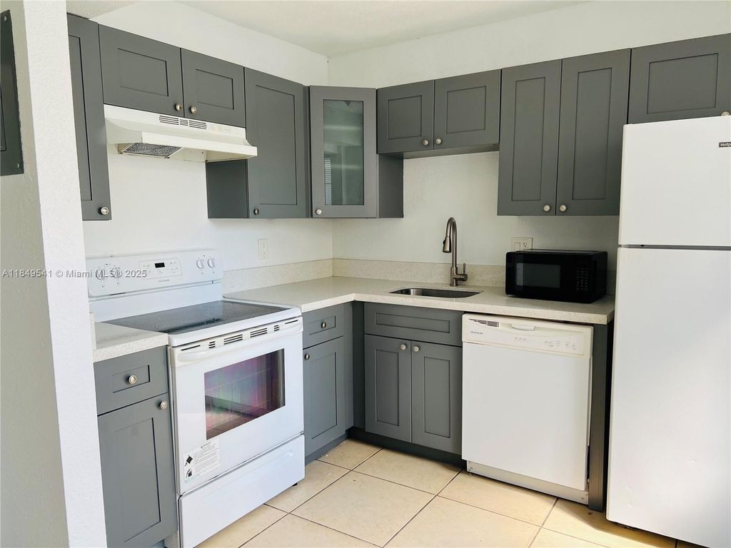 Photo of 4705 NW 9th Dr #4705, Plantation, FL 33317 (MLS # A11849541)