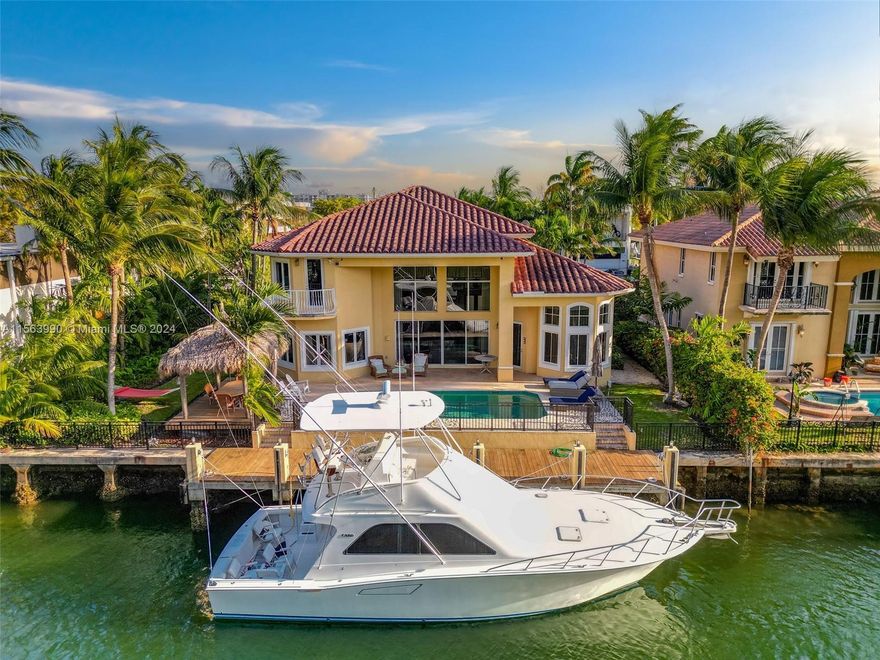 Welcome to the epitome of waterfront luxury living in Miami's prestigious Eastern Shores! This stunning 4-Bedroom, 3.5-Bathroom residence offers approximately 3,400 sqft of living space and 90-feet of PRIME waterfront. There are no-fixed bridges and a large dock for up to an 80-foot yacht. This property provides unparalleled access for boat enthusiasts with direct water access and breathtaking views. Inside, discover spacious living areas, 20ft high ceilings throughout, elegant finishes, custom wood and iron work and modern amenities seamlessly integrating indoor-outdoor living. Perfect for entertaining or unwinding in style. Situated in a gated neighborhood minutes to shopping, dining, and entertainment. This is the essence of Miami's coveted waterfront lifestyle.