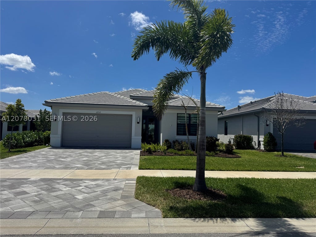 Photo of 12712 SW Blue Mangrove Pkwy, Port St Lucie, FL 34987 (MLS # A12078031)