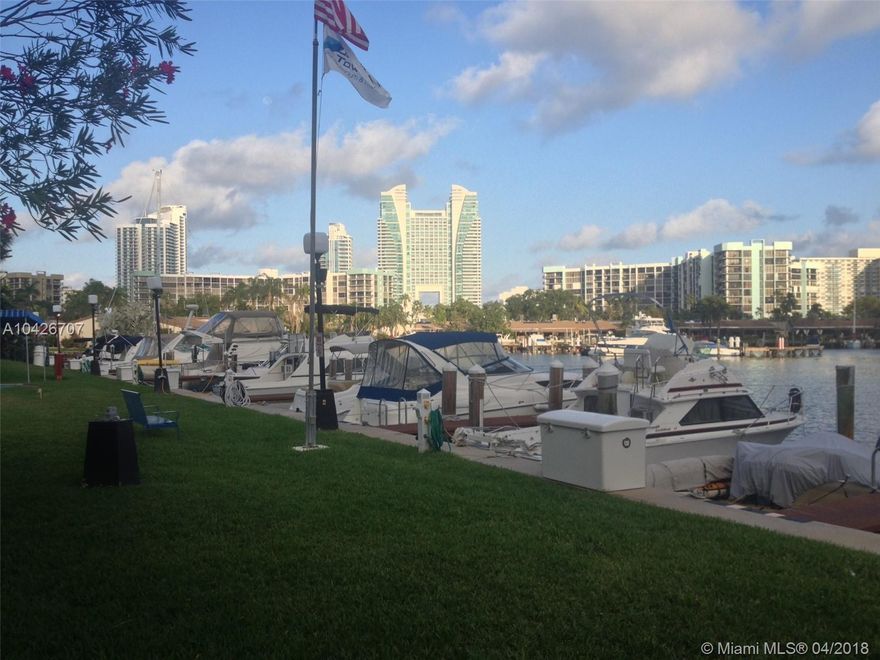 NICE FIRST FLOOR LEVEL IN A GREAT LOCATION ON THREE ISLANDS. COMPLETELY PAINTED IN NEUTRAL COLORS. WOOD FLOORS WITH NEW VERTICALS. ALL NEW KITCHEN APPLIANCES. UPDATED BATHROOMS. A/C IS 1 YEAR OLD. UNIT IS IN MOVE-IN CONDITION. THIS ALSO INCLUDES 1 COVERED PARKING SPACE CLOSE TO THE DOOR. AMENITIES INCLUDE TWO HEATED POOLS, MARINA, BBQ GRILLS. FIVE TENNIS COURTS. 24 HOUR SECURITY WITH VALET AND CONCIERGE. YOU CAN WALK TO THE BEACH, SHOPPING, RESTAURANTS AND BANKS. BASIC CABLE IS INCLUDED. STORM SHUTTERS.