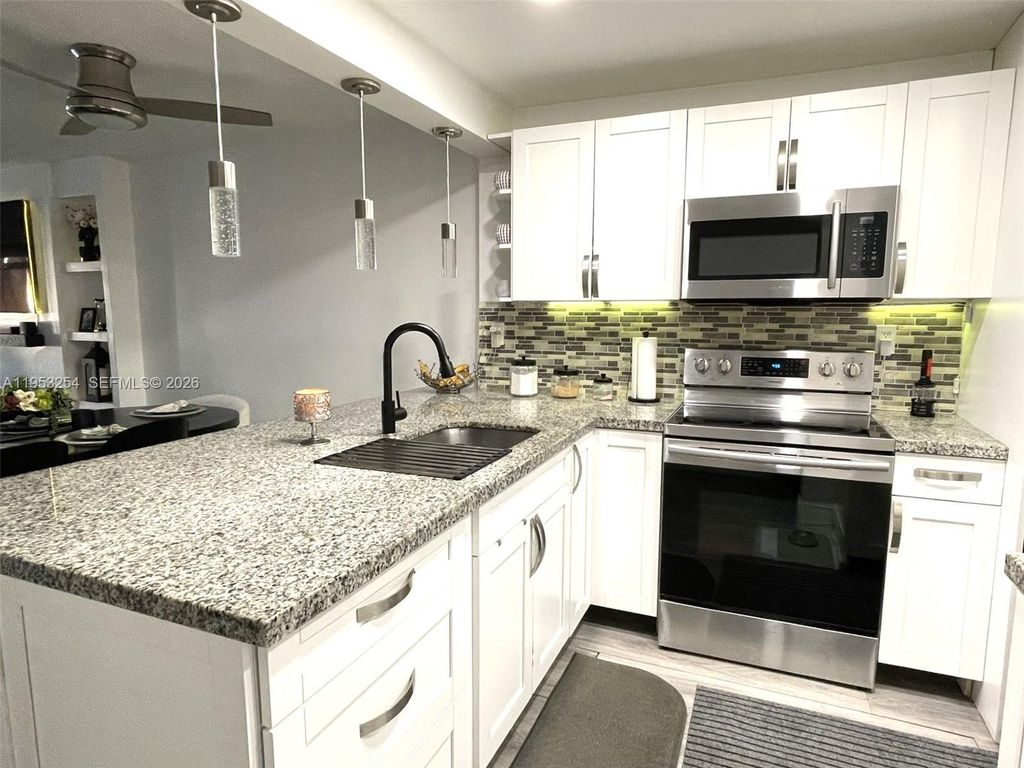 Photo of 7920 N Colony Cir N #109, Tamarac, FL 33321 (MLS # A11953254)