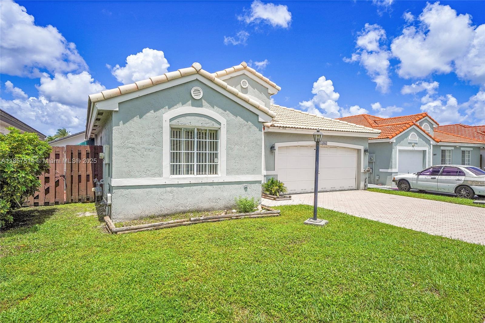 Wonderful 3/2 property with 2 car garage. Nice size patio for family gatherings. Property is fenced and private. Best price in the area! Tankless water heater, Hurricane shutters, AC 2017, Barrel tile roof 1998, Storage sheds.